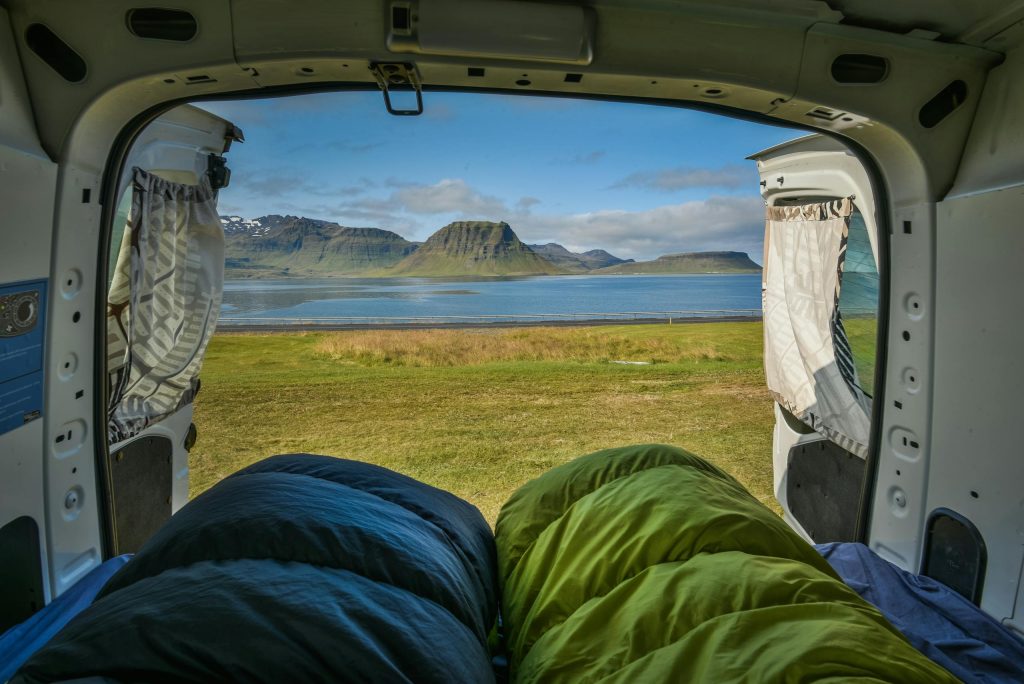 Breathtaking nature view from camper van by a lake in Iceland.