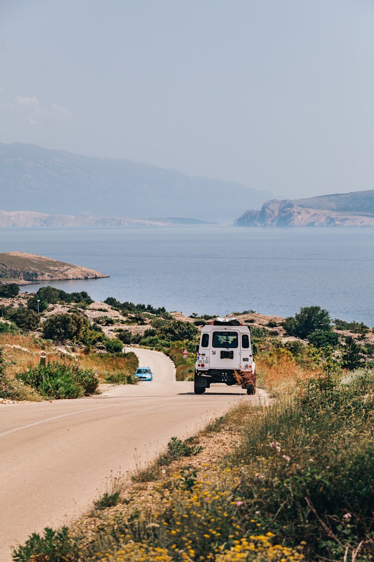 Explore the stunning coastal roads of Krk, Croatia, with breathtaking ocean views.